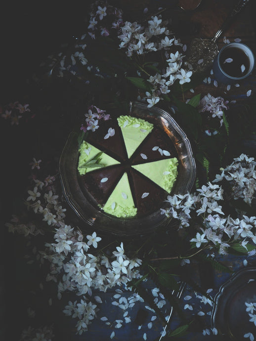 Gluten-free, dairy-free, vegan Delicious Chocolate Labu Cake and Decadent Double Mint Chocolate Cake surrounded by spring flowers